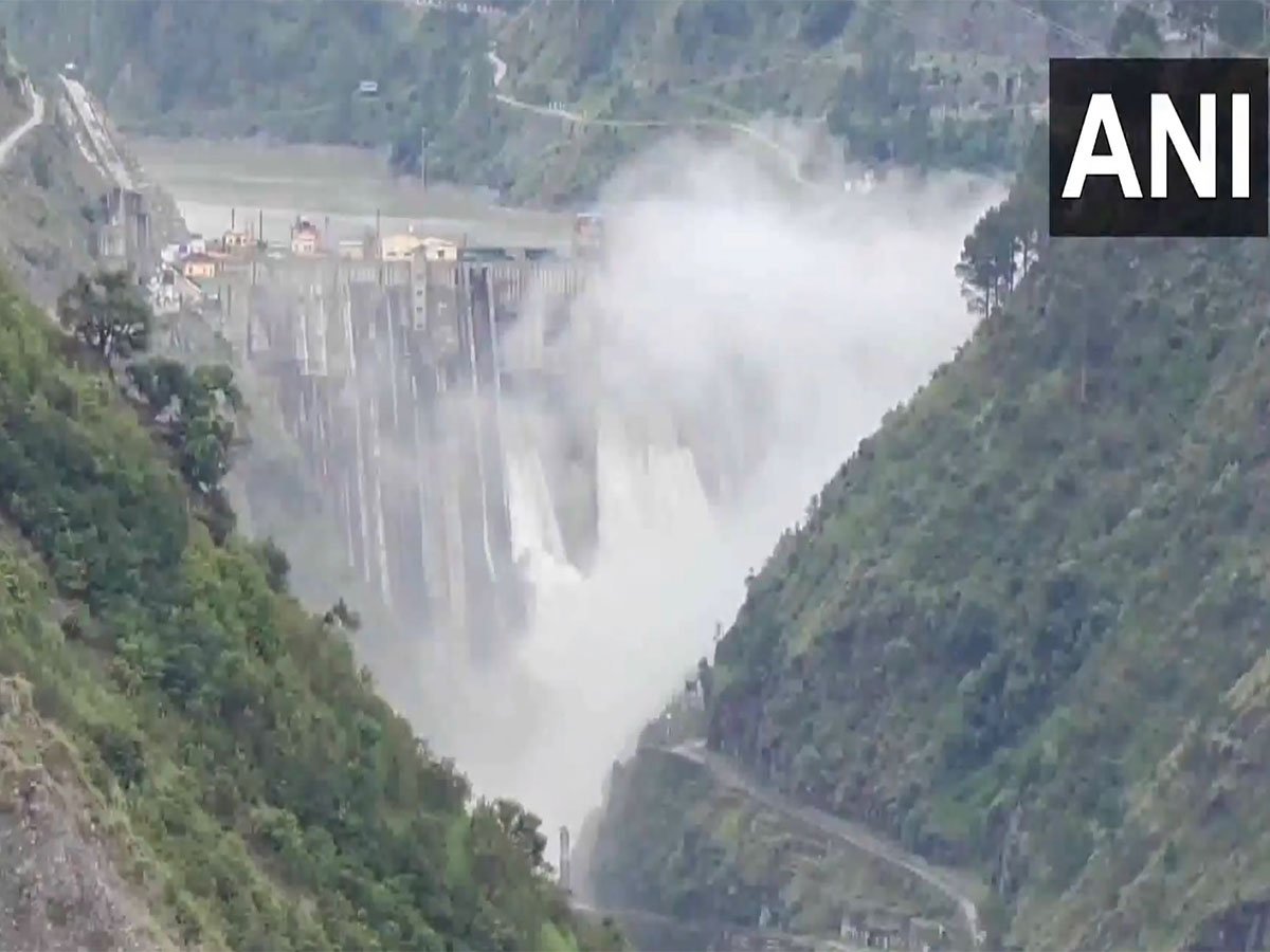 Water level rises in the Chenab River rises and the Baglihar Hydroelectric Power Project overflows due to heavy rainfall. (Photo/ANI)