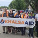 Punjabi Cultural Society joins Khalsa Aid for summer parade in…
