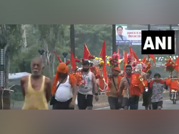 Kanwariyas arrive in large numbers in Moradabad with holy water from Haridwar ahead of last Sawan Monday (Photo/ANI) Kanwariyas arrive in large numbers in Moradabad with holy water from Haridwar ahead of last Sawan Monday (Photo/ANI)