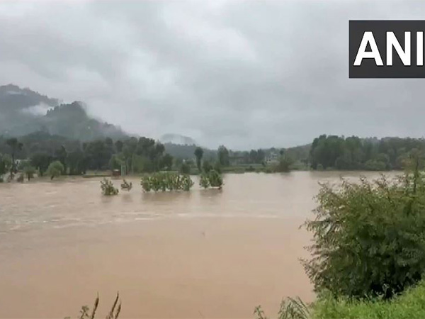 Rivers overflow as the district continues to struggle with heavy rainfall and cloud bursts. (Photo/ANI) Rivers overflow as the district continues to struggle with heavy rainfall and cloud bursts. (Photo/ANI)