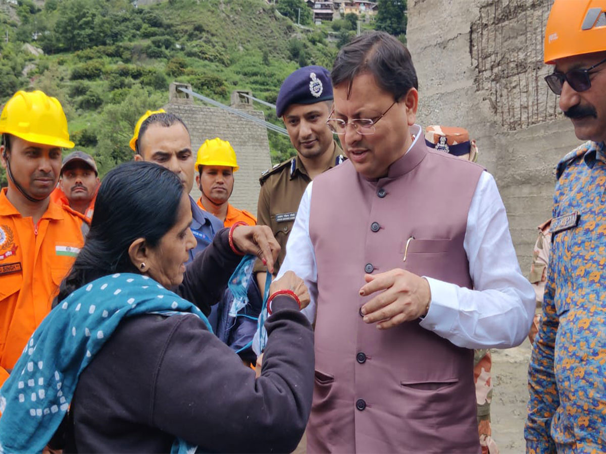 Gujarati tourist stuck in Uttarakhand due to floods ties rakhi to CM Dhami (Photo/X @pushkardhami) Gujarati tourist stuck in Uttarakhand due to floods ties rakhi to CM Dhami (Photo/X @pushkardhami)