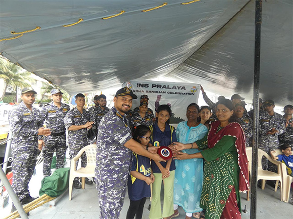 Specially-abled girls from the Anandi Foundation ties Rakhi to Navy personnels (Photo/@IN_HQMNA) Specially-abled girls from the Anandi Foundation ties Rakhi to Navy personnels (Photo/@IN_HQMNA)