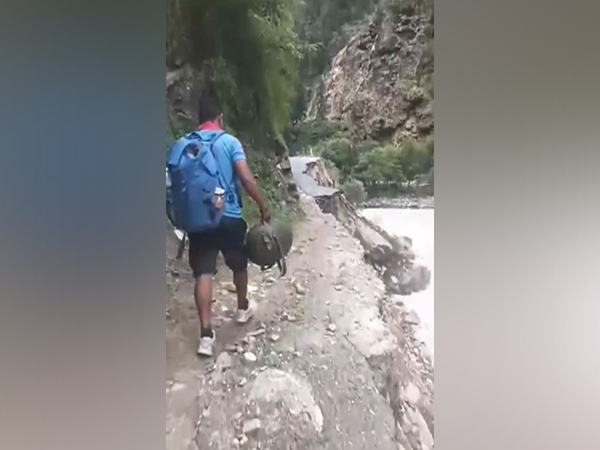 Uttarakhand Police flood unit personnel conducts search and rescue on foot in disaster-hit areas of Dehradun (Photo/ANI) Uttarakhand Police flood unit personnel conducts search and rescue on foot in disaster-hit areas of Dehradun (Photo/ANI)