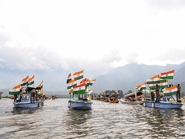 CRPF Jawans carry National Flags in boats during 'Har Ghar Tiranga' rally in Srinagar (Photo/ANI) CRPF Jawans carry National Flags in boats during 'Har Ghar Tiranga' rally in Srinagar (Photo/ANI)