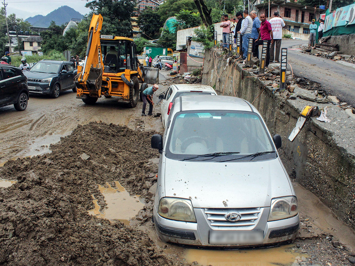 JCB clears the debris for vehicles stuck in the silt. (File photo/ANI) JCB clears the debris for vehicles stuck in the silt. (File photo/ANI)
