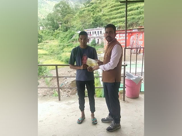Relief amount distributed to families affected in Pauri Garhwal district disaster (Photo/ANI) Relief amount distributed to families affected in Pauri Garhwal district disaster (Photo/ANI)