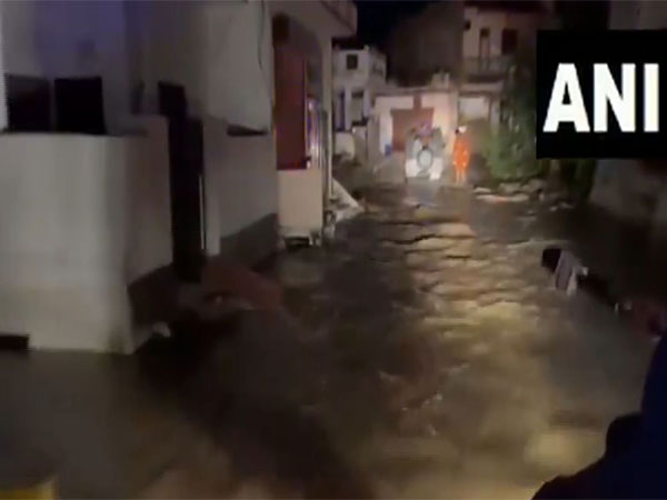 Boraj dam collapses in Rajasthan's Ajmer; streets flooded, people rescued. (Photo/ANI) Boraj dam collapses in Rajasthan's Ajmer; streets flooded, people rescued. (Photo/ANI)