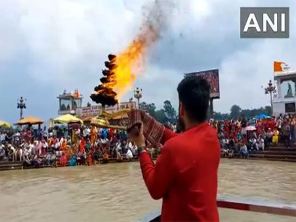 Ganga Aarti was performed in the afternoon today ahead of the complete Lunar Eclipse (Photo/ANI) Ganga Aarti was performed in the afternoon today ahead of the complete Lunar Eclipse (Photo/ANI)