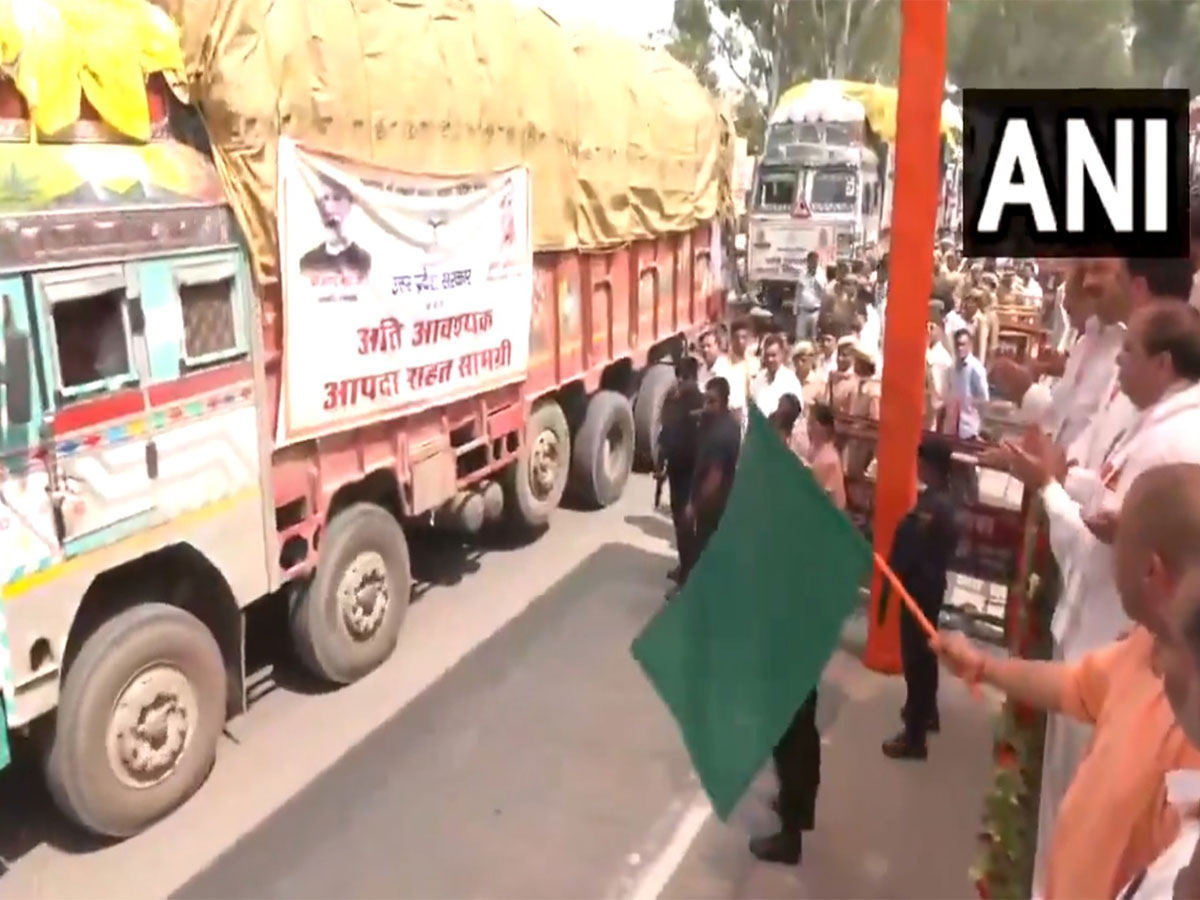 UP CM Yogi flags of 48 trucks of relief materials to flood-affected states (Photo/ANI) UP CM Yogi flags of 48 trucks of relief materials to flood-affected states (Photo/ANI)