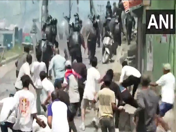 Protesters chase and pelt stones at security personnel in Kathmandu (Photo/ANI)