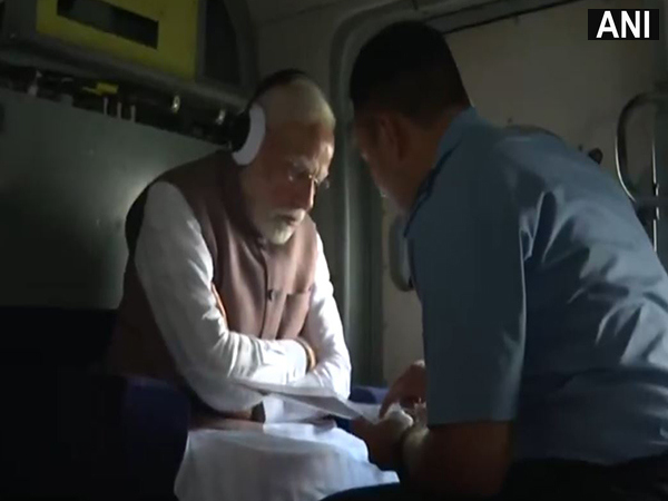 PM Modi conducts aerial survey of flood-hit areas of Punjab (Photo/ANI) PM Modi conducts aerial survey of flood-hit areas of Punjab (Photo/ANI)