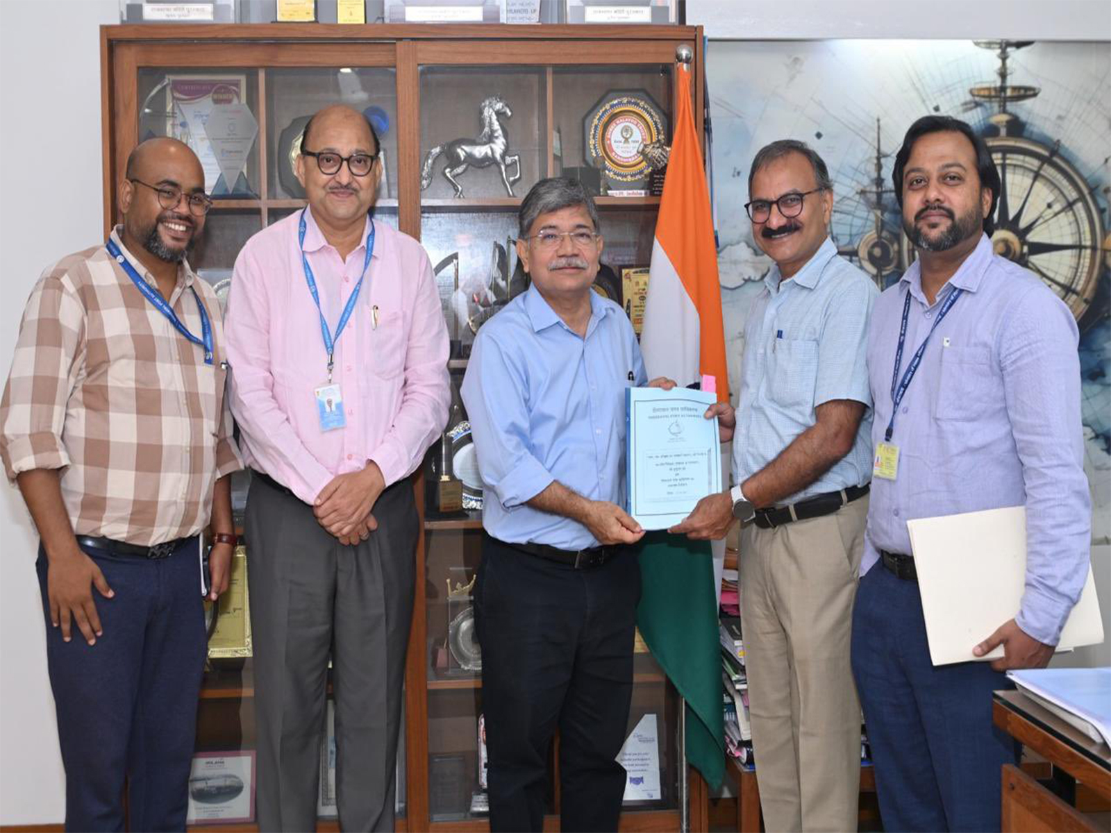 Mrityunjay Jha, Director (Coordination and Official Language) in the Ministry of Ports, Shipping and Waterways, with DPA Chairman Sushil Kumar Singh and other officials. (Photo/@Deendayal_Port) Mrityunjay Jha, Director (Coordination and Official Language) in the Ministry of Ports, Shipping and Waterways, with DPA Chairman Sushil Kumar Singh and other officials. (Photo/@Deendayal_Port)