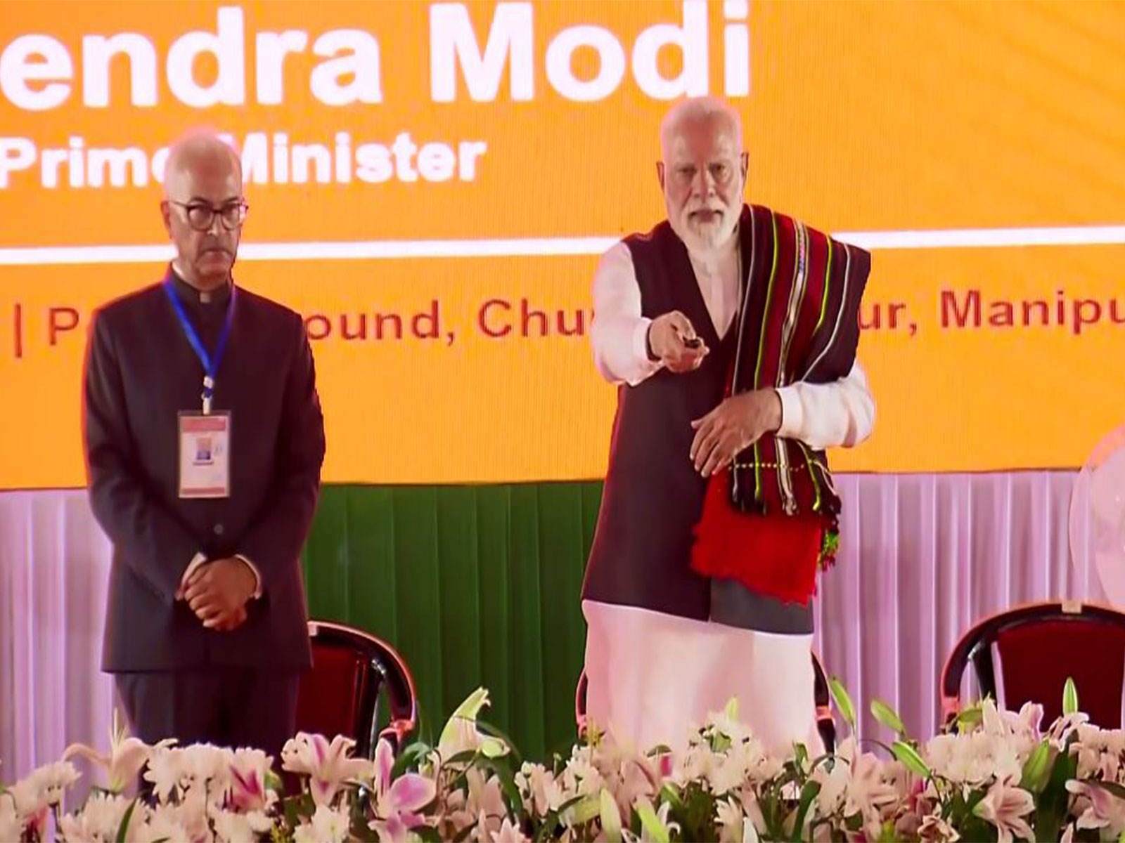 PM Modi lays foundation of multiple projects at Churachandpur (Photo/ANI/DD) PM Modi lays foundation of multiple projects at Churachandpur (Photo/ANI/DD)