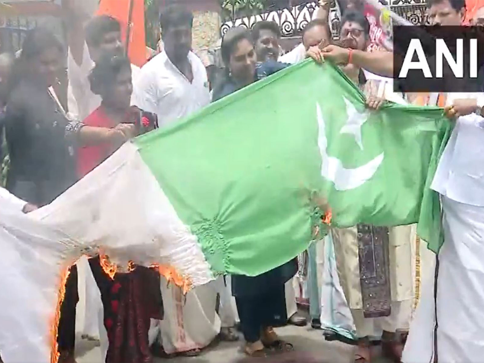 Shiv Sena (UBT) burns Pakistani national flag in protest against Ind-Pak match (Photo/ANI) Shiv Sena (UBT) burns Pakistani national flag in protest against Ind-Pak match (Photo/ANI)