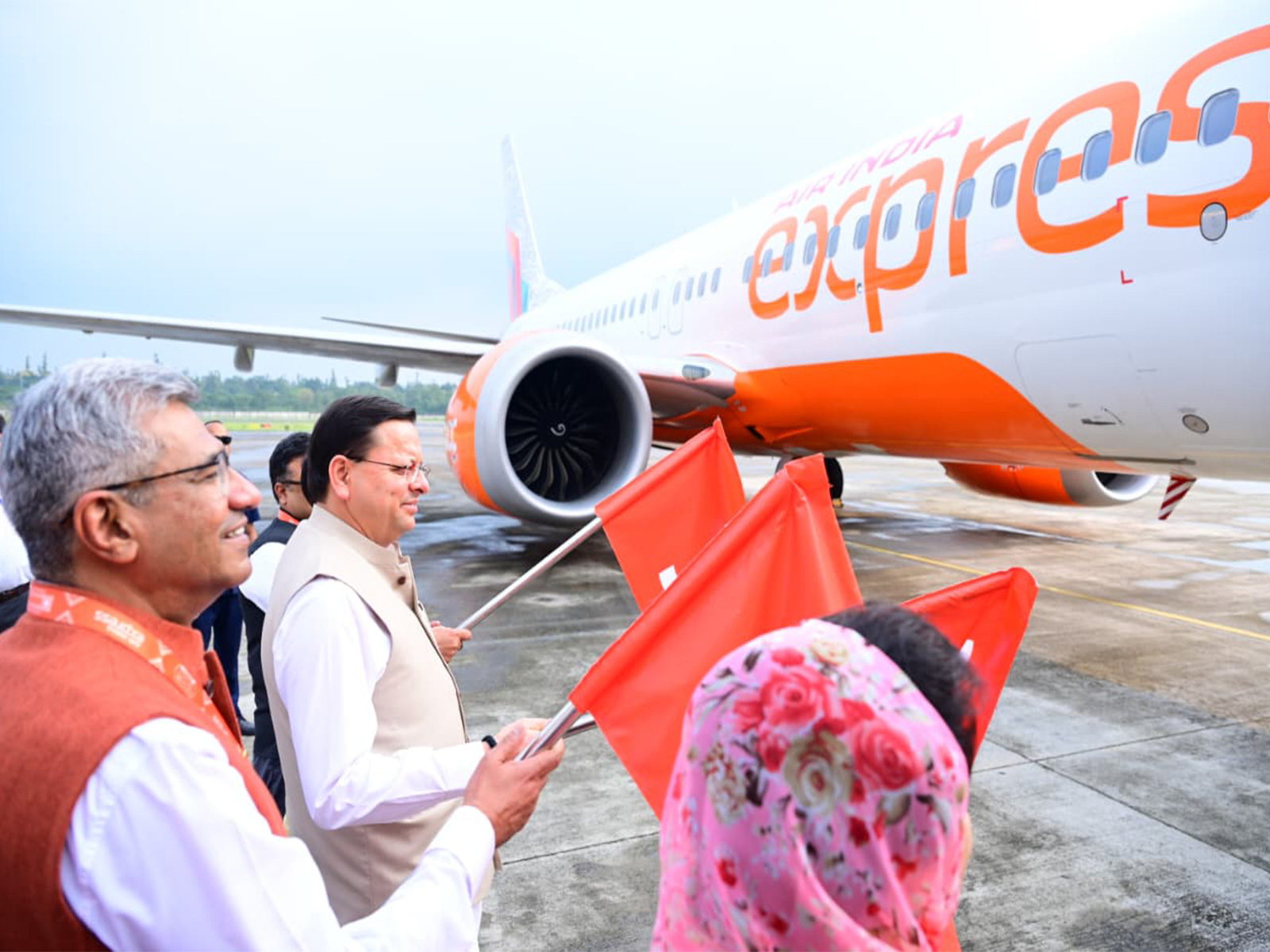 Uttarakhand CM flags off New Air India Express flight (Photo/ANI) Uttarakhand CM flags off New Air India Express flight (Photo/ANI)