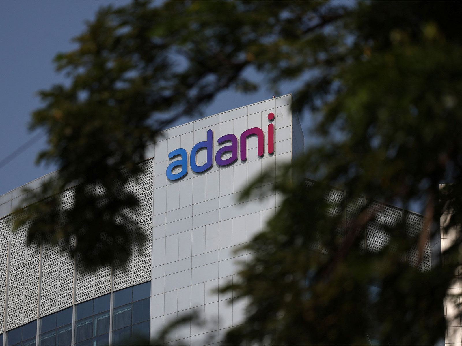 Logo of Adani Group on facade of its Corporate House on the outskirts of Ahmedabad (File Photo/ Reuters) Logo of Adani Group on facade of its Corporate House on the outskirts of Ahmedabad (File Photo/ Reuters)