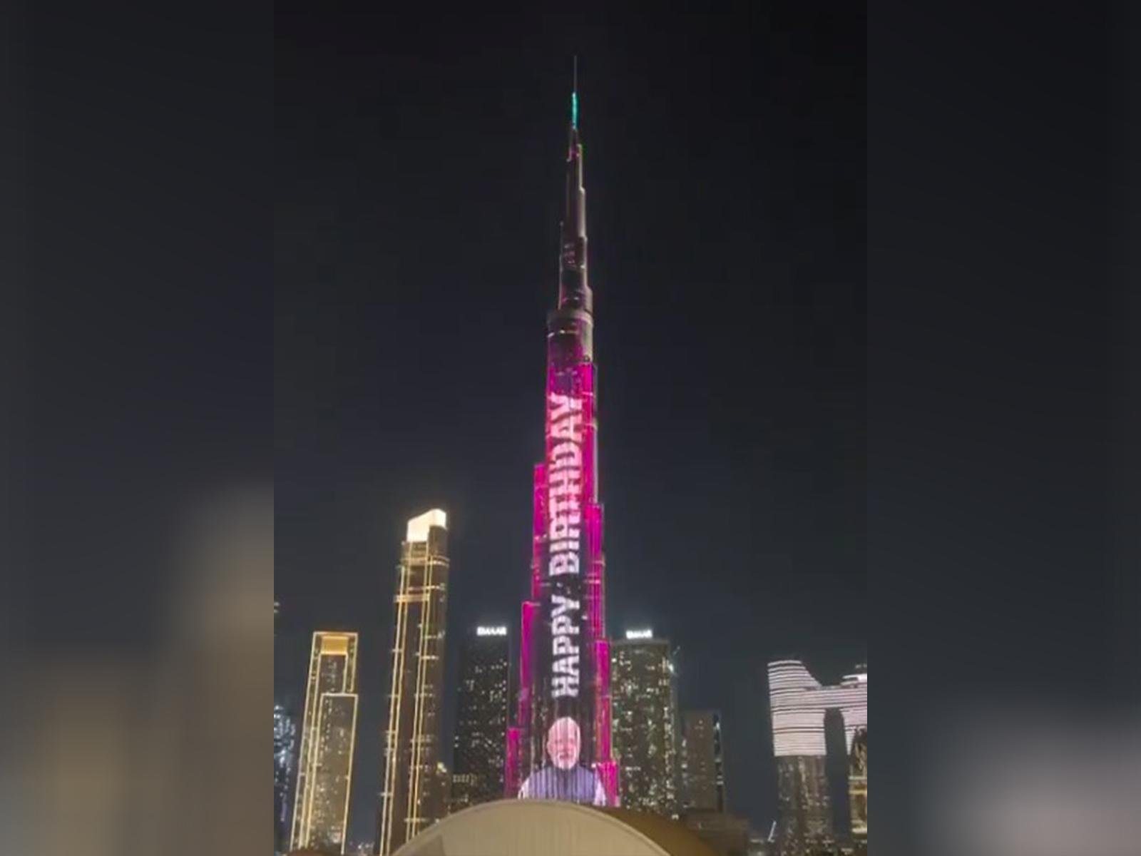 Dubai's Burj Khalifa illuminated tonight with the images of PM Narendra Modi (Photo/ANI)