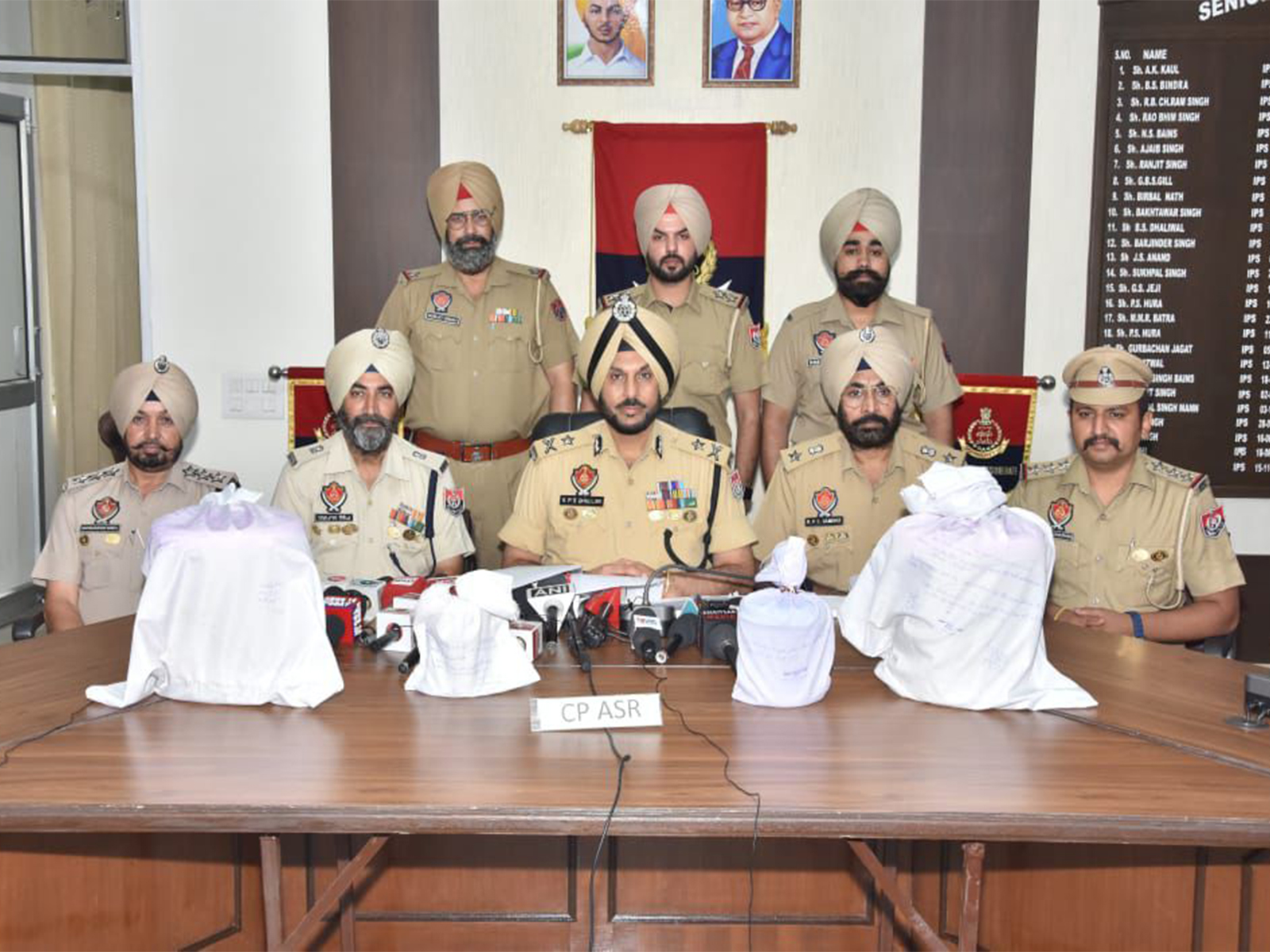 Punjab police with recovered heroin. (Photo/ANI) Punjab police with recovered heroin. (Photo/ANI)