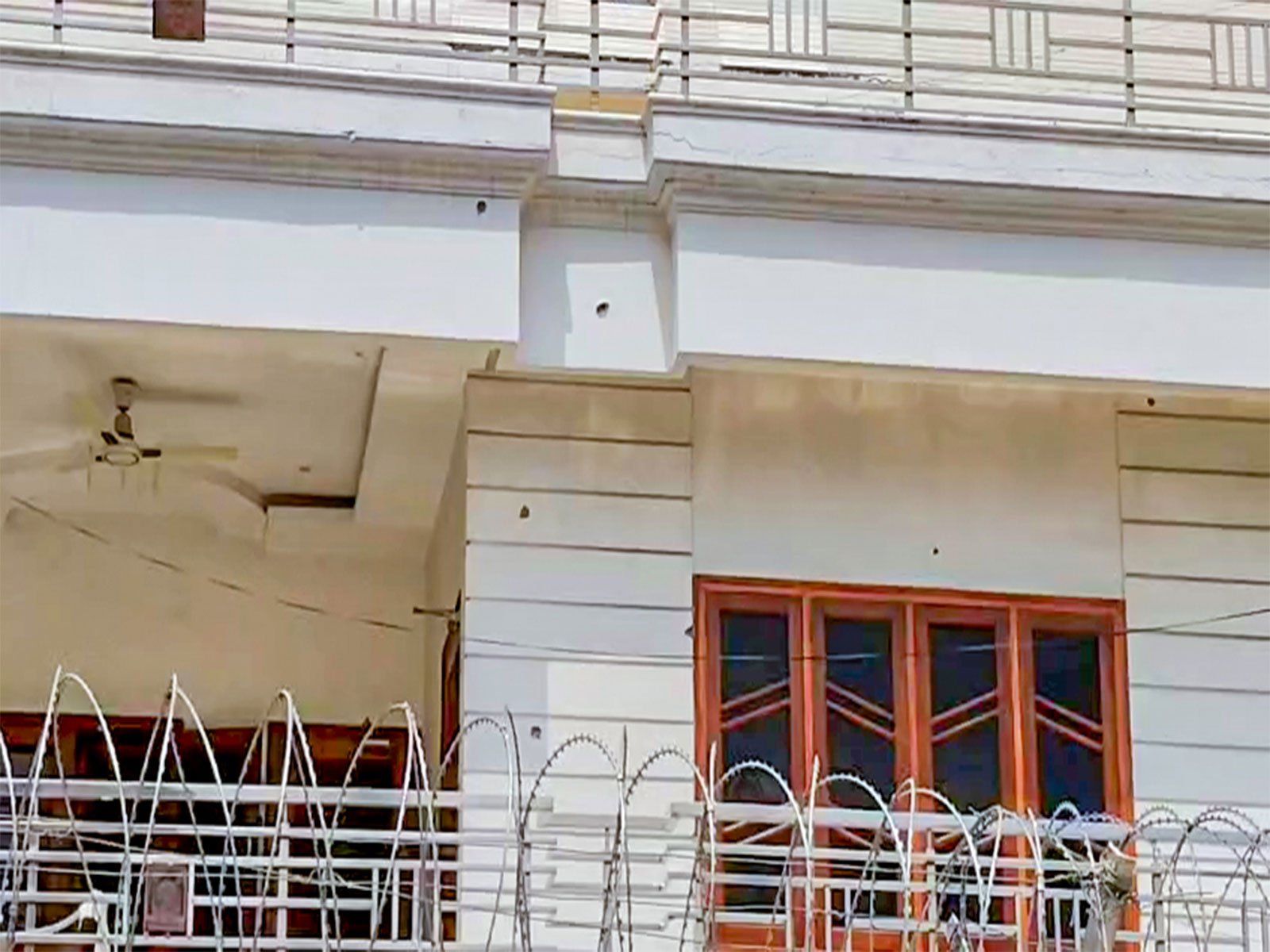 Bullet marks at actress Disha Patani's Bareilly residence (Photo/ANI) Bullet marks at actress Disha Patani's Bareilly residence (Photo/ANI)