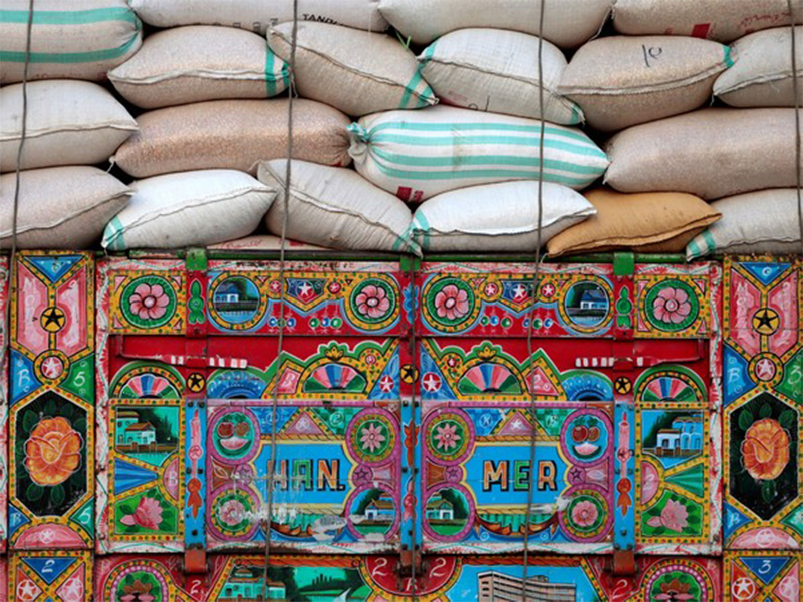 Wheat sacks loaded on a truck in Pakistan amid movement restrictions causing flour shortages in other provinces (File Photo/Reuters) Wheat sacks loaded on a truck in Pakistan amid movement restrictions causing flour shortages in other provinces (File Photo/Reuters)