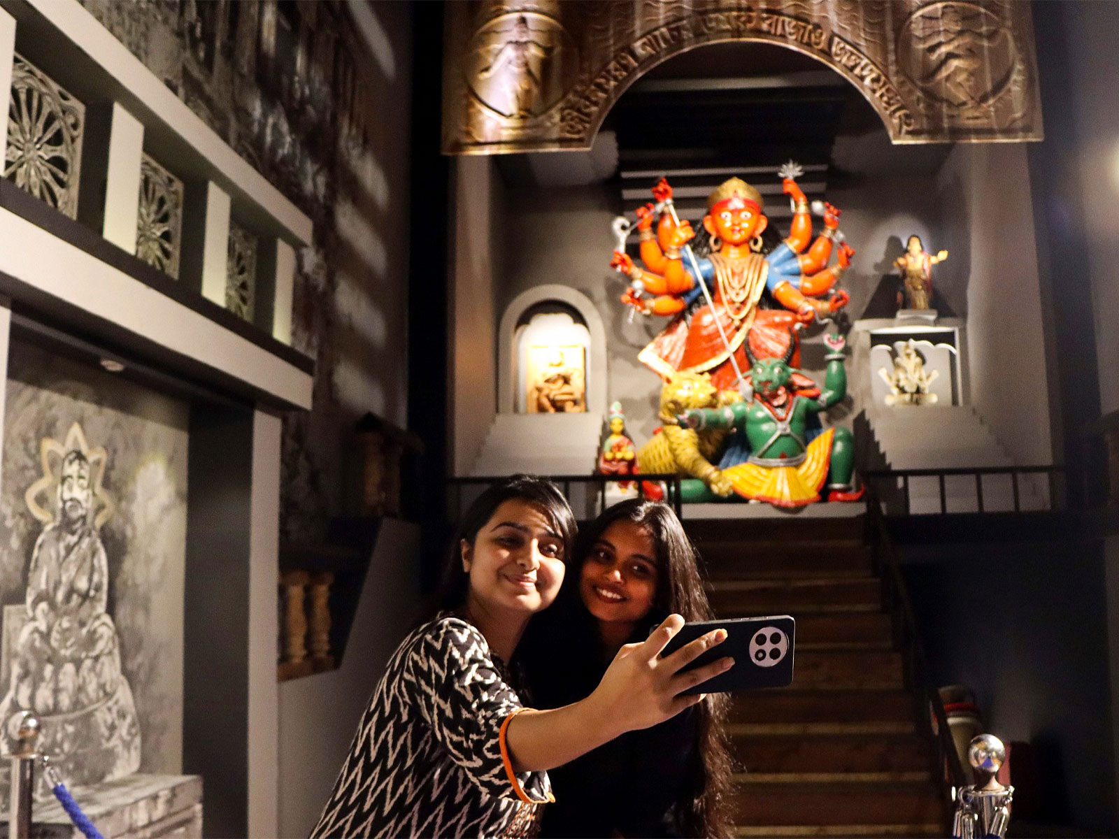 Girls click a selfie during the inauguration of the Durga Puja festival (File Photo/ ANI) Girls click a selfie during the inauguration of the Durga Puja festival (File Photo/ ANI)