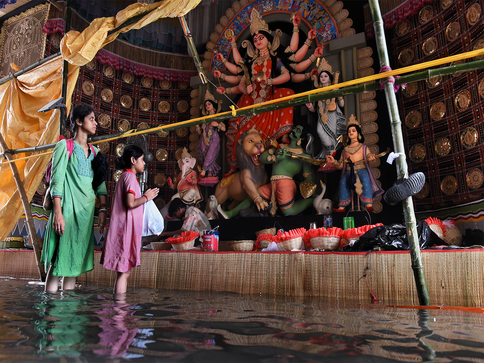 Durga puja pandal gets waterlogged after heavy rainfall in Kolkata (Photo/ANI) Durga puja pandal gets waterlogged after heavy rainfall in Kolkata (Photo/ANI)