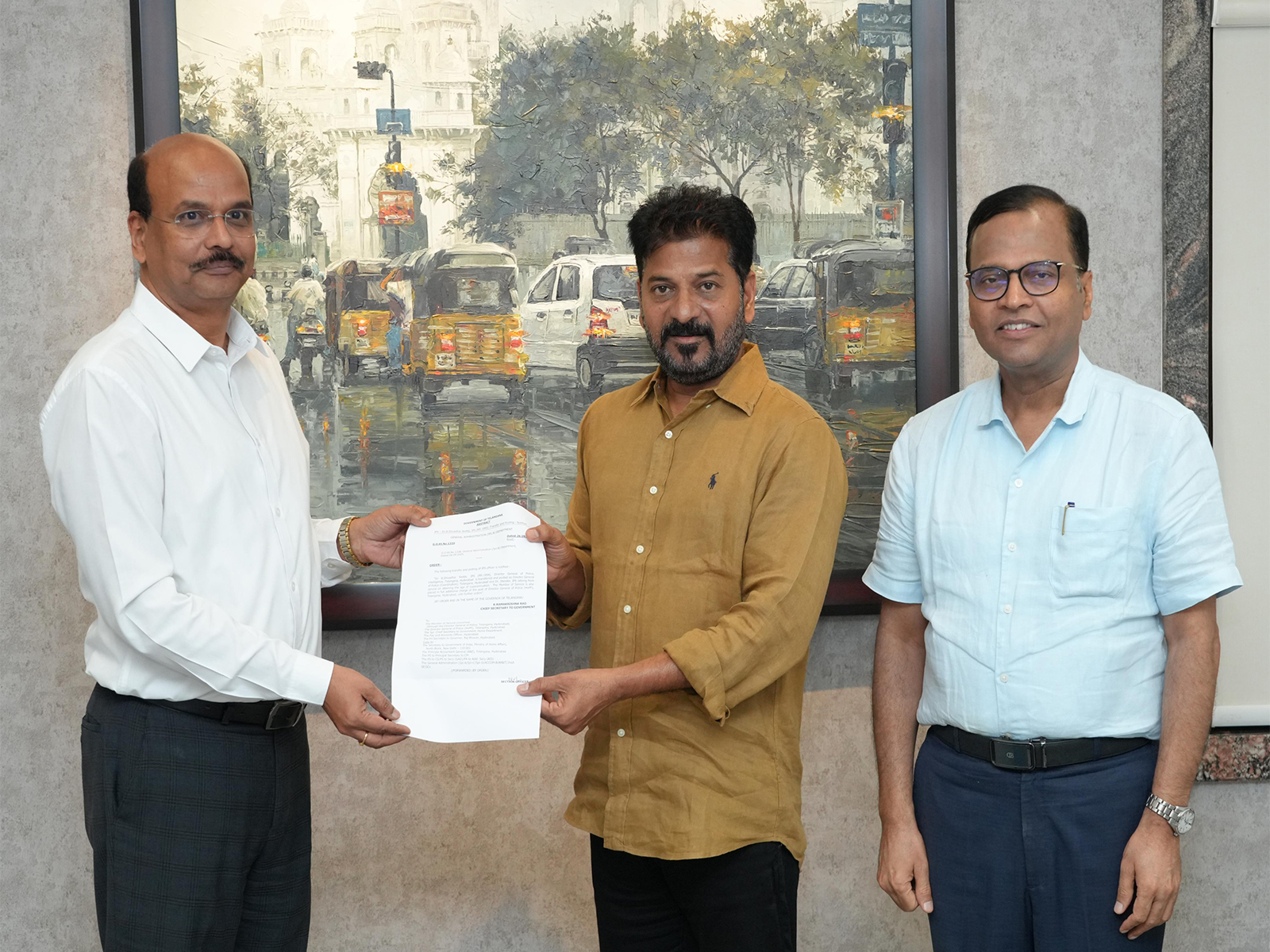 Telangana CM Revanth Reddy hands over appointment orders to B Shivadhar Reddy. (Photo/ANI) Telangana CM Revanth Reddy hands over appointment orders to B Shivadhar Reddy. (Photo/ANI)