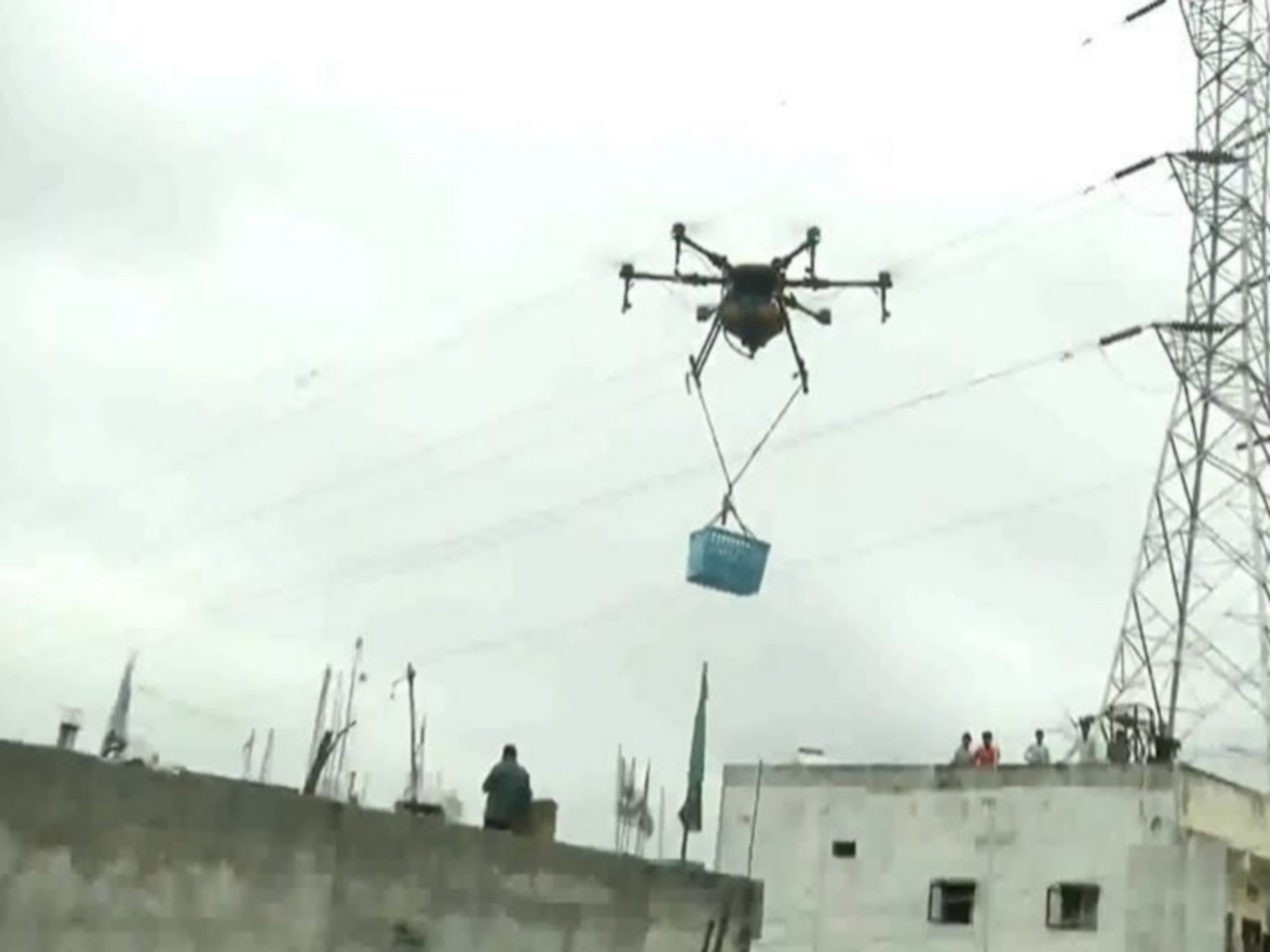 Rescue teams delivering food and other supplies in flood-hit areas. (Photo/ANI) Rescue teams delivering food and other supplies in flood-hit areas. (Photo/ANI)