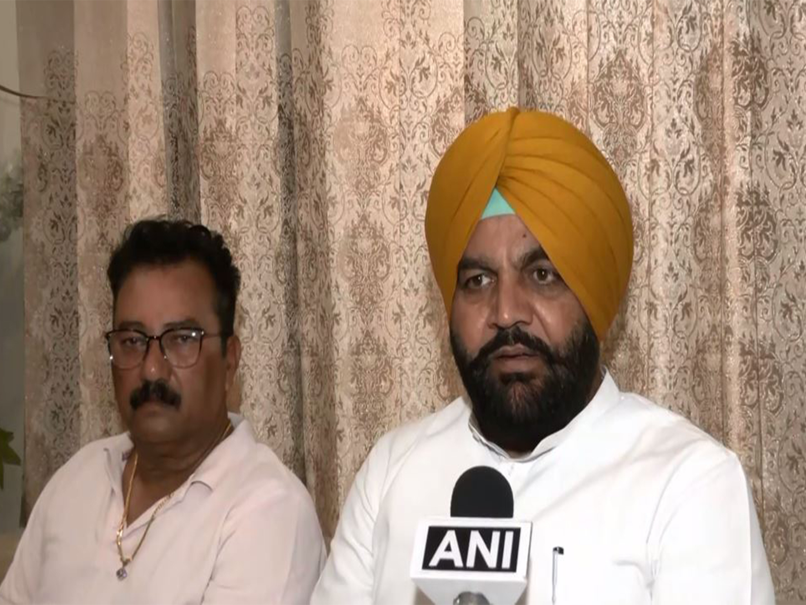 Congress MP Gurjeet Singh Aujla with Abhishek Sharma's father (Photo/ANI) Congress MP Gurjeet Singh Aujla with Abhishek Sharma's father (Photo/ANI)