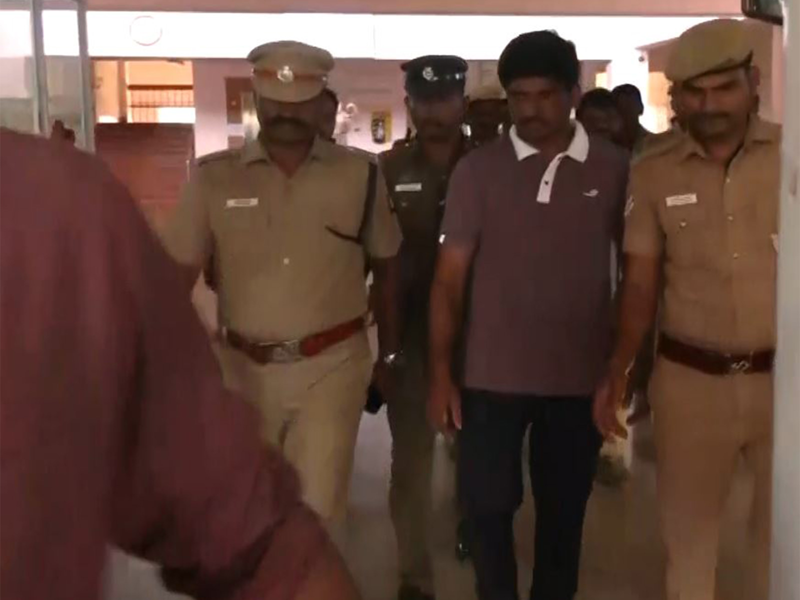 Arrested TVK functionary taken into custody (Photo/ANI) Arrested TVK functionary taken into custody (Photo/ANI)