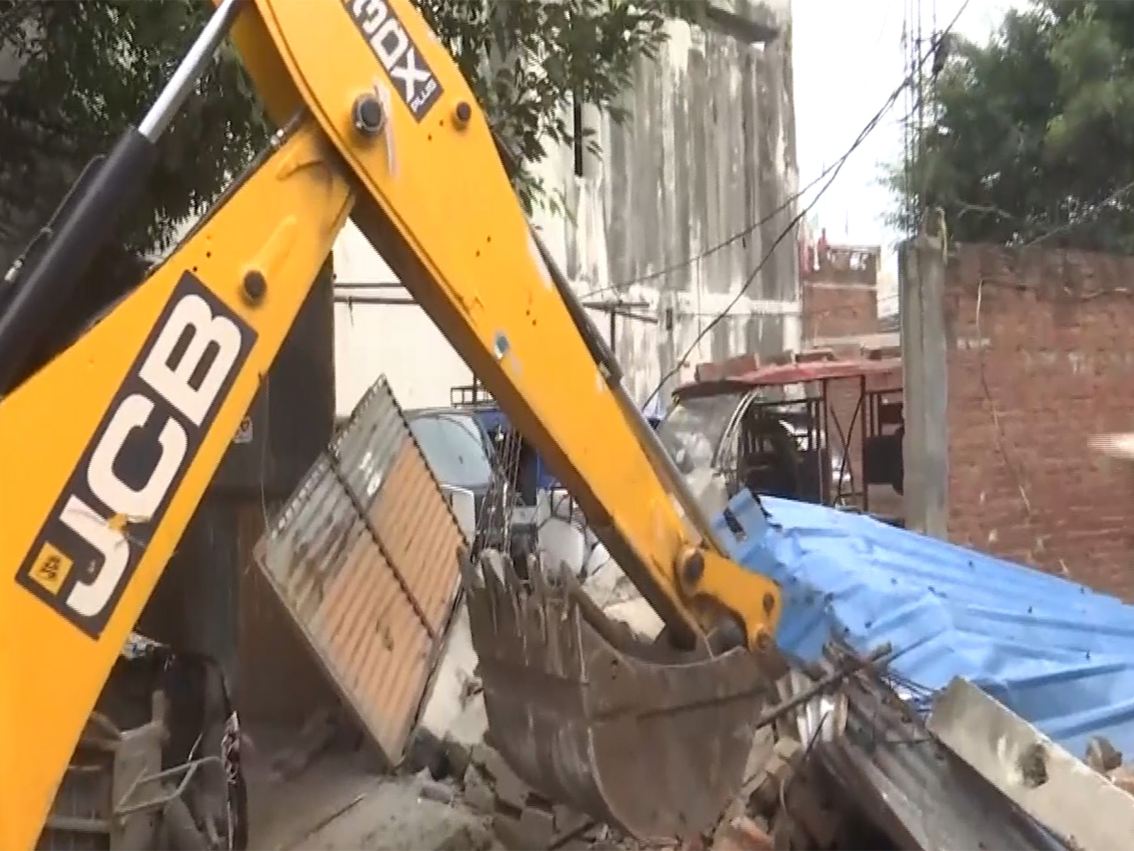 Bulldozer action on Maulana Mohsin Raza's property (Photo/ANI)