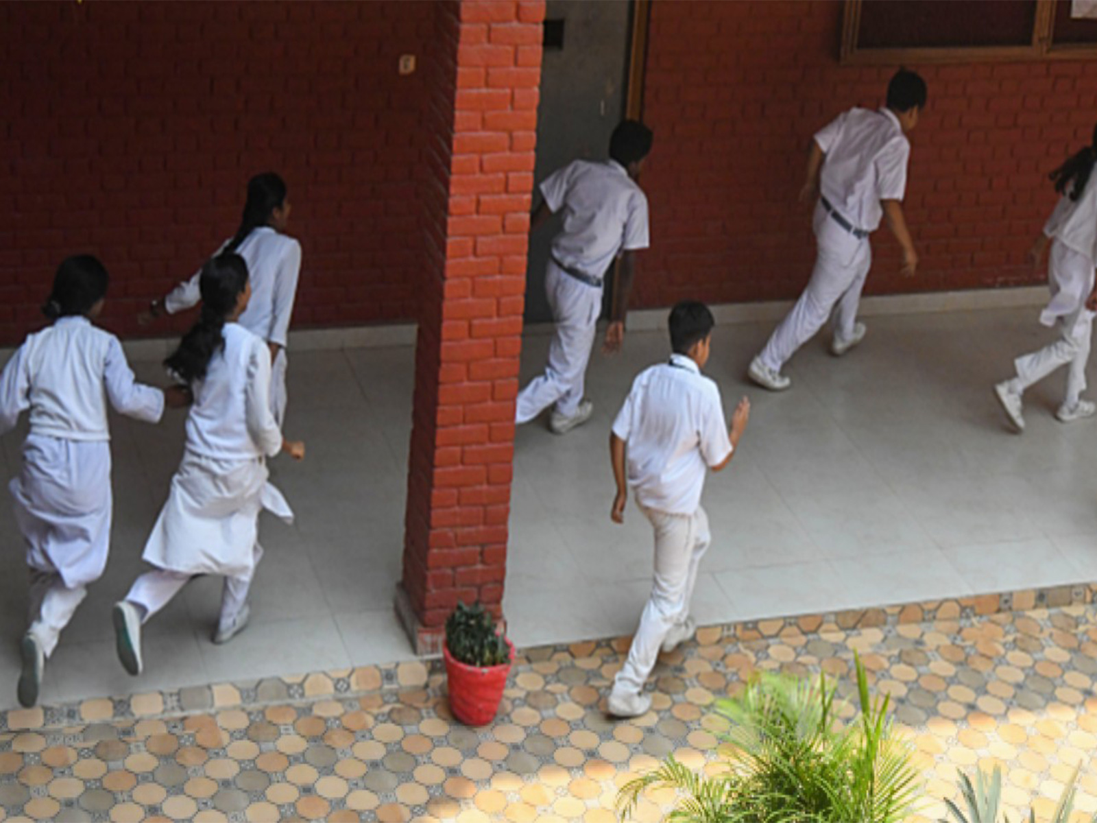 School students in Kerala running on the school ground (Photo/ANI) School students in Kerala running on the school ground (Photo/ANI)