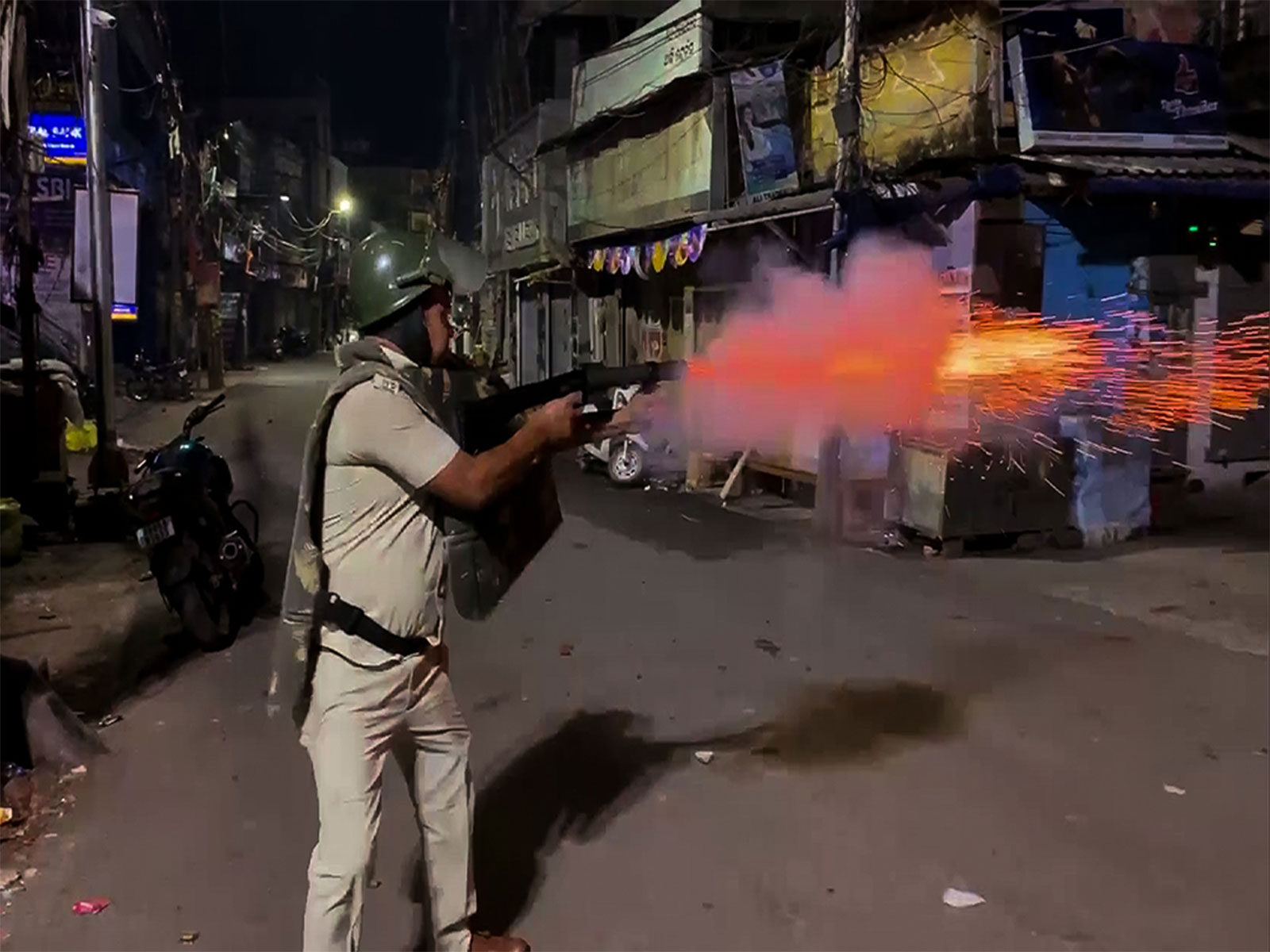 Police use tear gas to disperse people after a clash between two groups in Cuttack (Photo/ANI) Police use tear gas to disperse people after a clash between two groups in Cuttack (Photo/ANI)