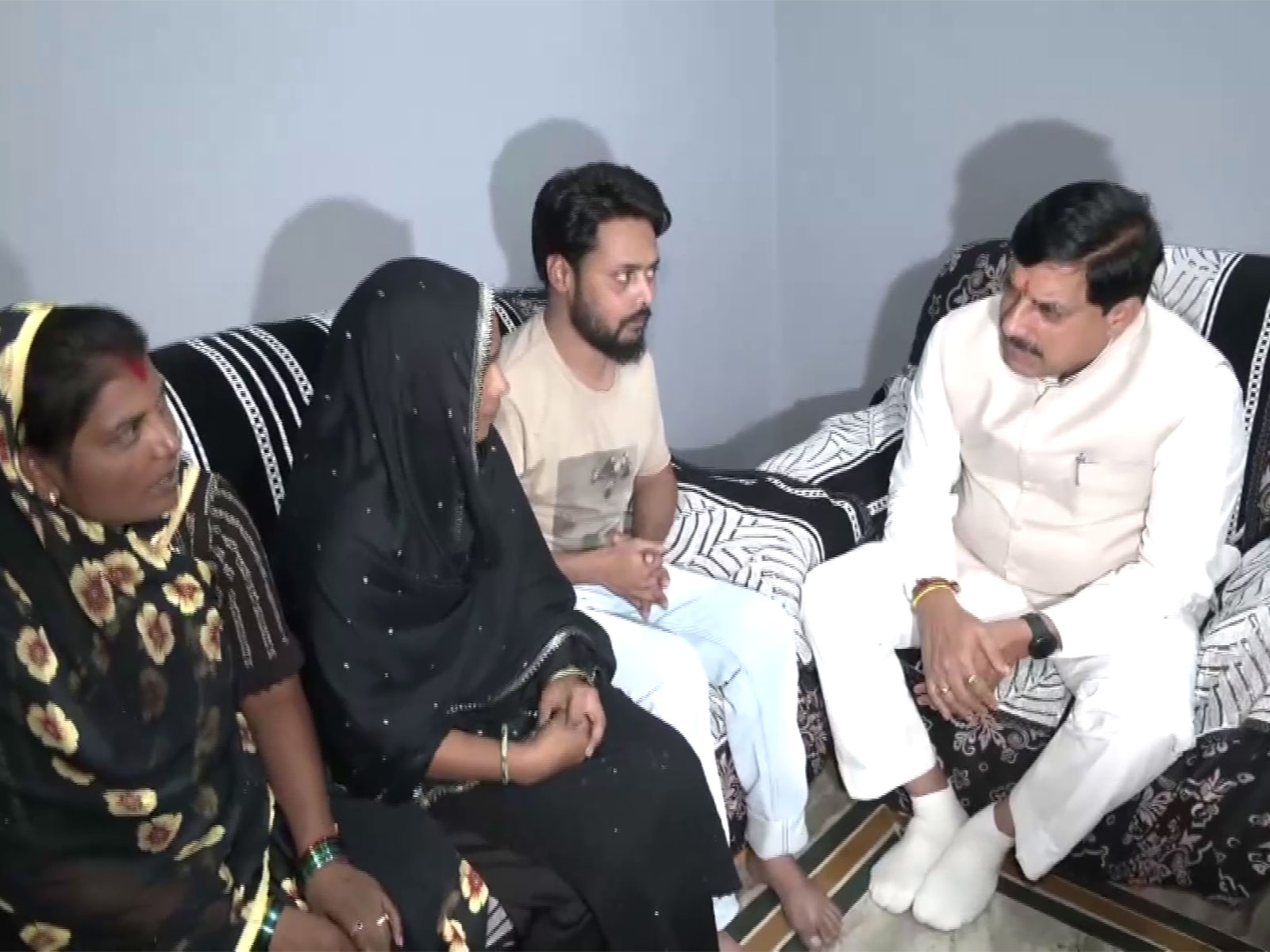 MP CM Mohan Yadav is talking to the families of Children lost life in Chhindwara cough syrup tragedy (Photo/ANI) MP CM Mohan Yadav is talking to the families of Children lost life in Chhindwara cough syrup tragedy (Photo/ANI)