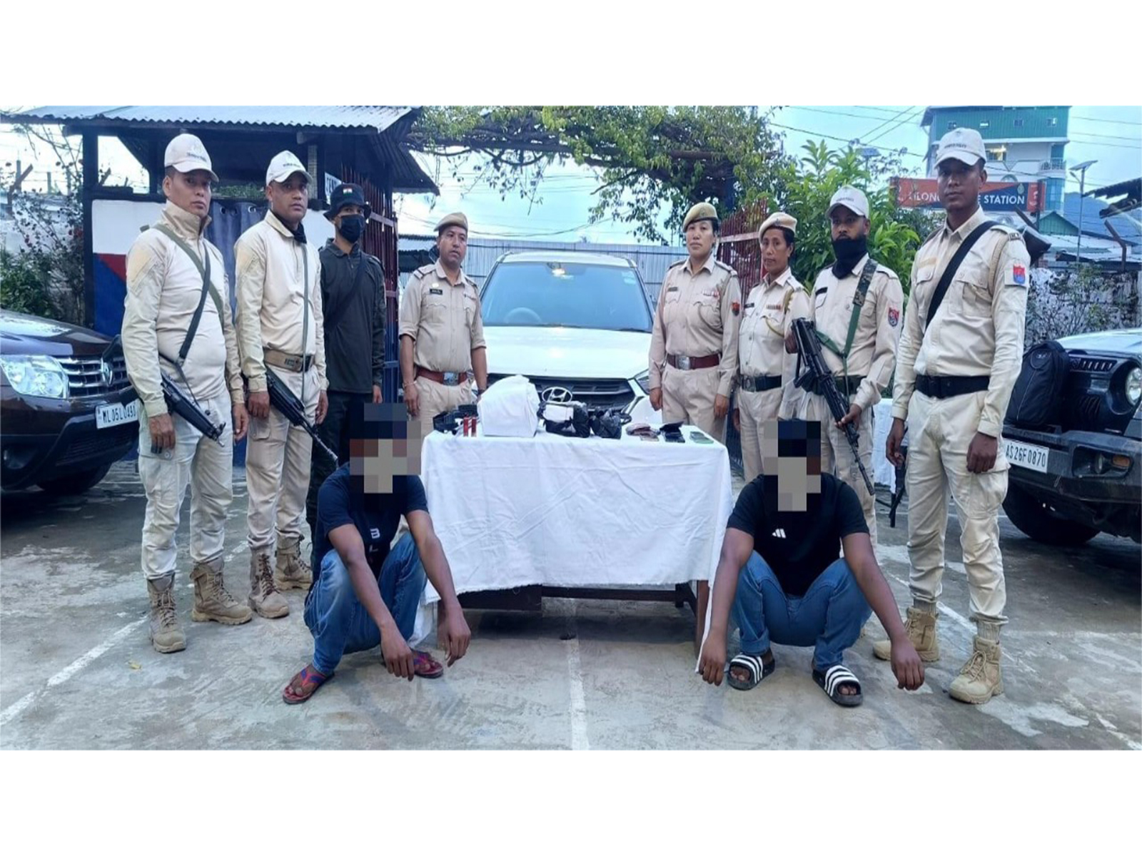 Police personnel with two alleged drug peddlers in Manipur (Photo: @manipur_police/X) Police personnel with two alleged drug peddlers in Manipur (Photo: @manipur_police/X)