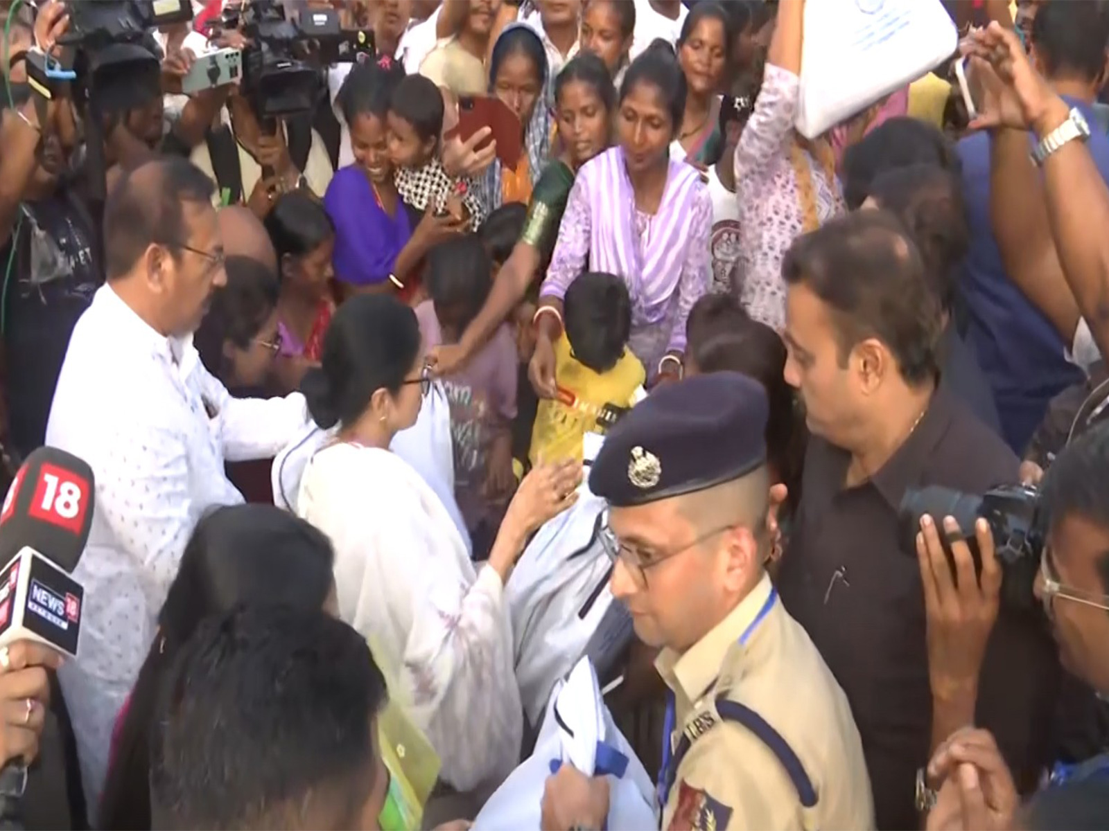 CM Mamata Banerjee distributes relief material in Hasimara. (Photo/ANI) CM Mamata Banerjee distributes relief material in Hasimara. (Photo/ANI)