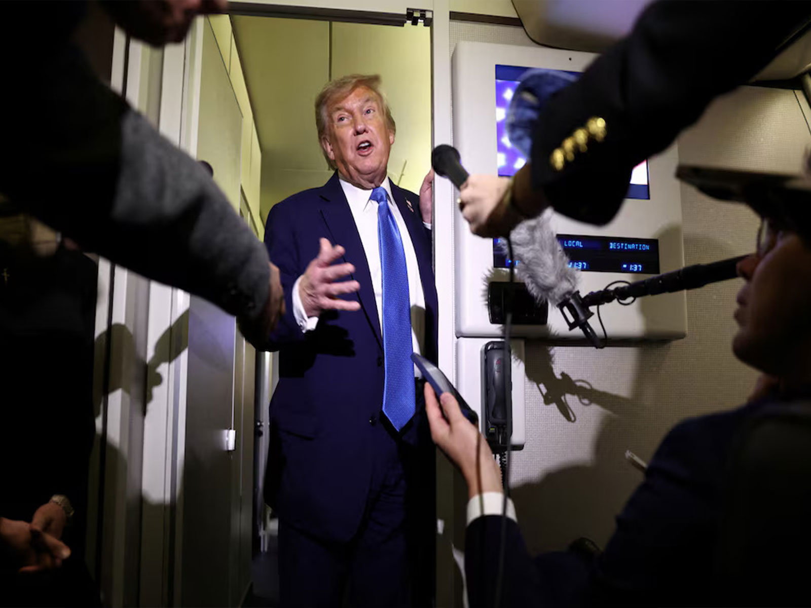 US President Donald Trump speaks to reporters aboard Air Force One (Photo/Reuters) US President Donald Trump speaks to reporters aboard Air Force One (Photo/Reuters)
