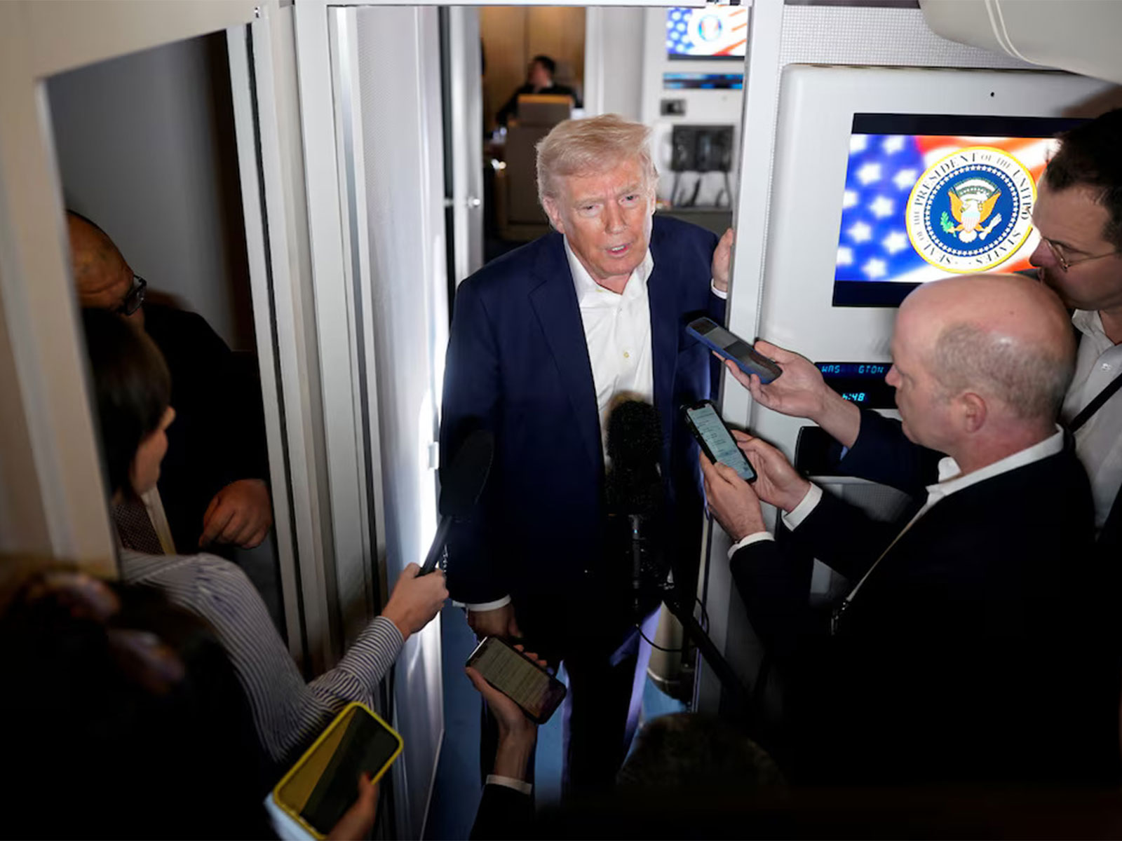 US President Donald Trump speaks to reporters aboard Air Force One during a press gaggle. (Photo/Reuters) US President Donald Trump speaks to reporters aboard Air Force One during a press gaggle. (Photo/Reuters)