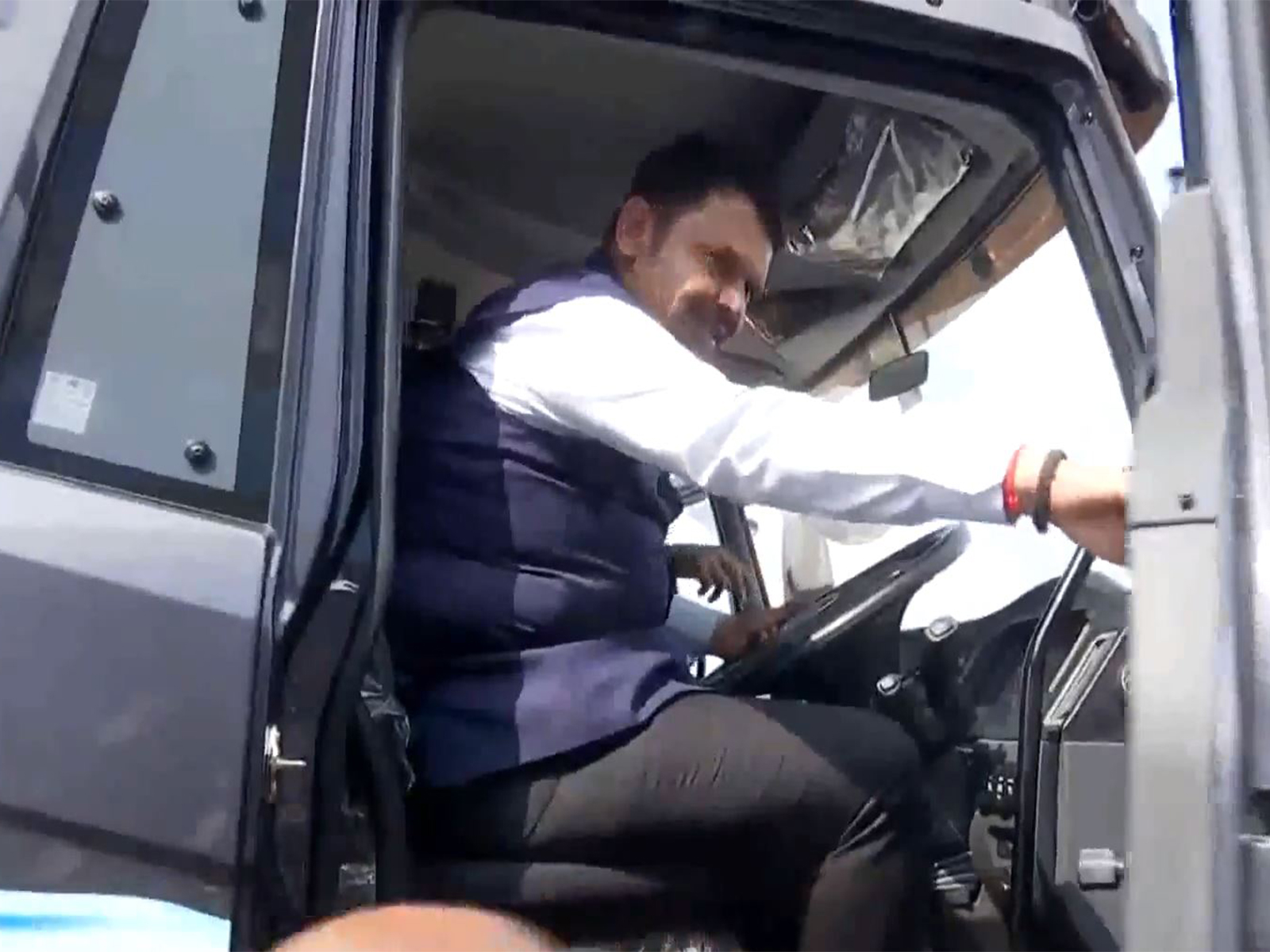 CM Devendra Fadnavis tries his hand at a BEM's electric heavy-duty truck (Photo/ANI) CM Devendra Fadnavis tries his hand at a BEM's electric heavy-duty truck (Photo/ANI)