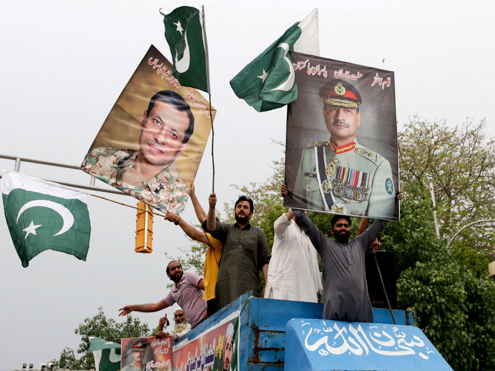 People carry posters showing the pictures of Chief of Army Staff of Pakistan Asim Munir (Photo/Reuters) People carry posters showing the pictures of Chief of Army Staff of Pakistan Asim Munir (Photo/Reuters)