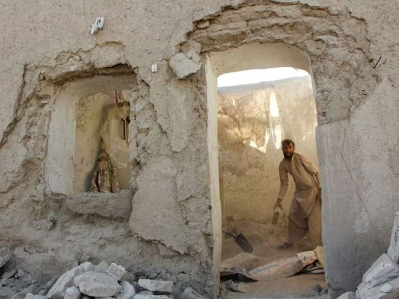 A man clears debris from his house damaged during Pakistani airstrike in Afghanistan (Photo/Reuters) A man clears debris from his house damaged during Pakistani airstrike in Afghanistan (Photo/Reuters)