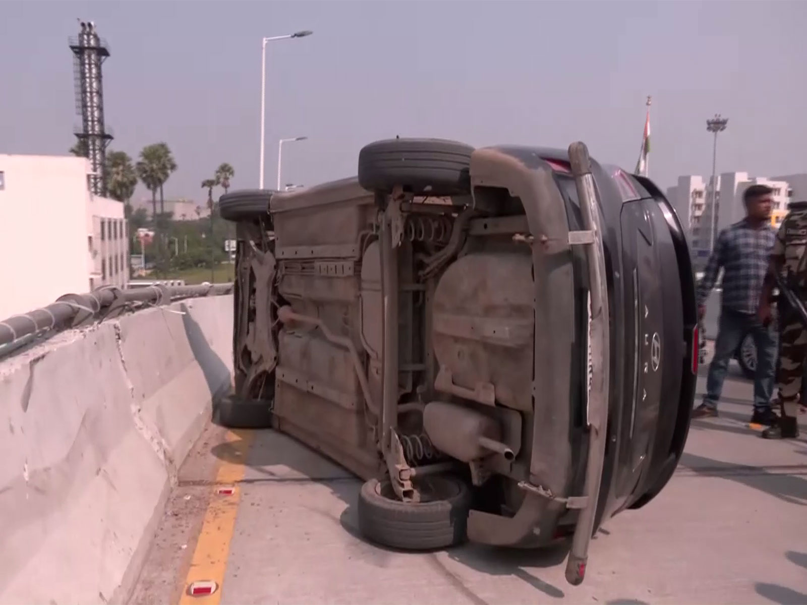 A car overturned at Patna Airport departure terminal building (Photo/ANI) A car overturned at Patna Airport departure terminal building (Photo/ANI)
