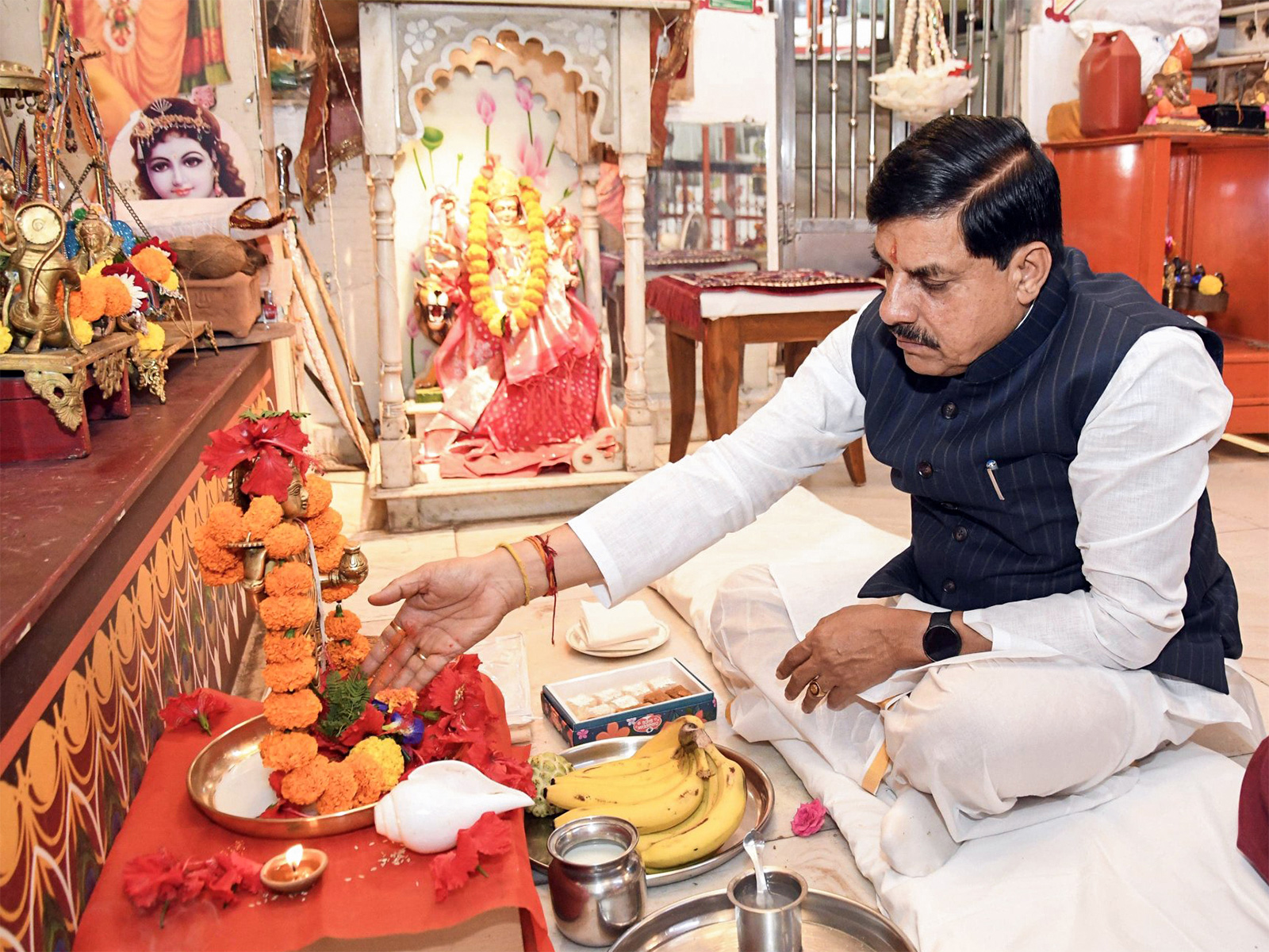 Mohan Yadav offers prayers on occasion of Dhanteras at his residence, in Bhopal. (Photo/ANI) Mohan Yadav offers prayers on occasion of Dhanteras at his residence, in Bhopal. (Photo/ANI)
