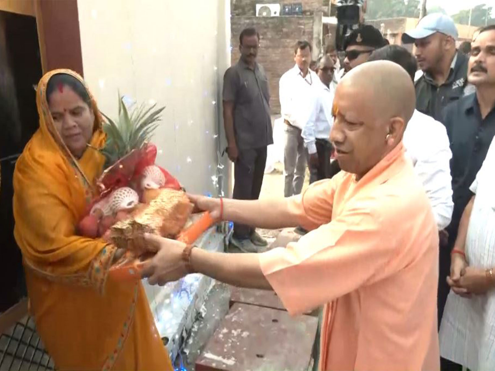 UP CM Yogi Adityanath distributes sweets, fruits to the people in Ayodhya on the occasion of Diwali (Photo/ANI) UP CM Yogi Adityanath distributes sweets, fruits to the people in Ayodhya on the occasion of Diwali (Photo/ANI)
