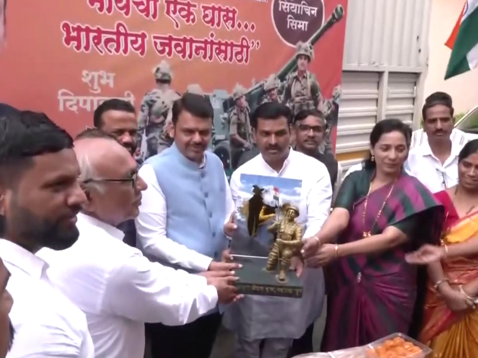 Maharashtra CM Devendra Fadnavis flags off trucks carying Diwali sweets for jawans. (Photo/ANI) Maharashtra CM Devendra Fadnavis flags off trucks carying Diwali sweets for jawans. (Photo/ANI)