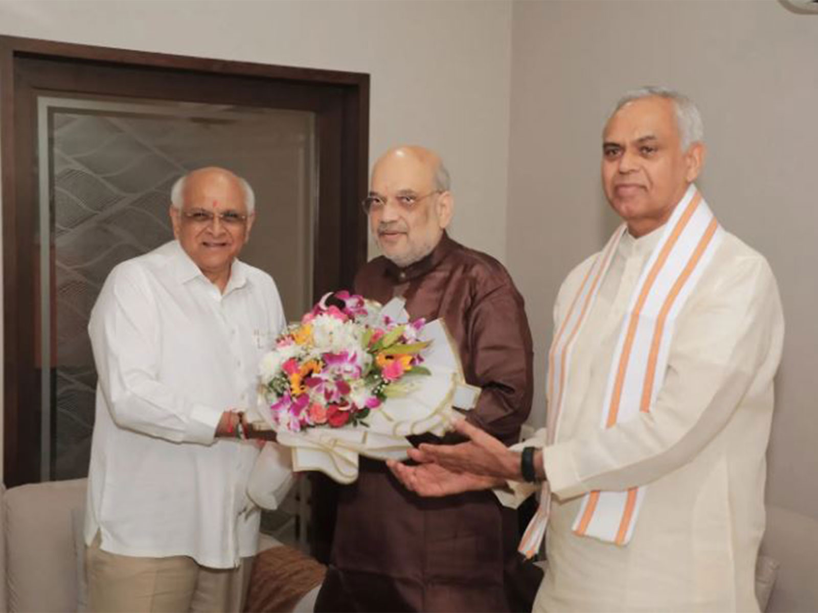 Gujarat Governor Acharya Devvrat, CM Bhupendra Patel visit Amit Shah on his 61st birthday (Photo/ANI) Gujarat Governor Acharya Devvrat, CM Bhupendra Patel visit Amit Shah on his 61st birthday (Photo/ANI)