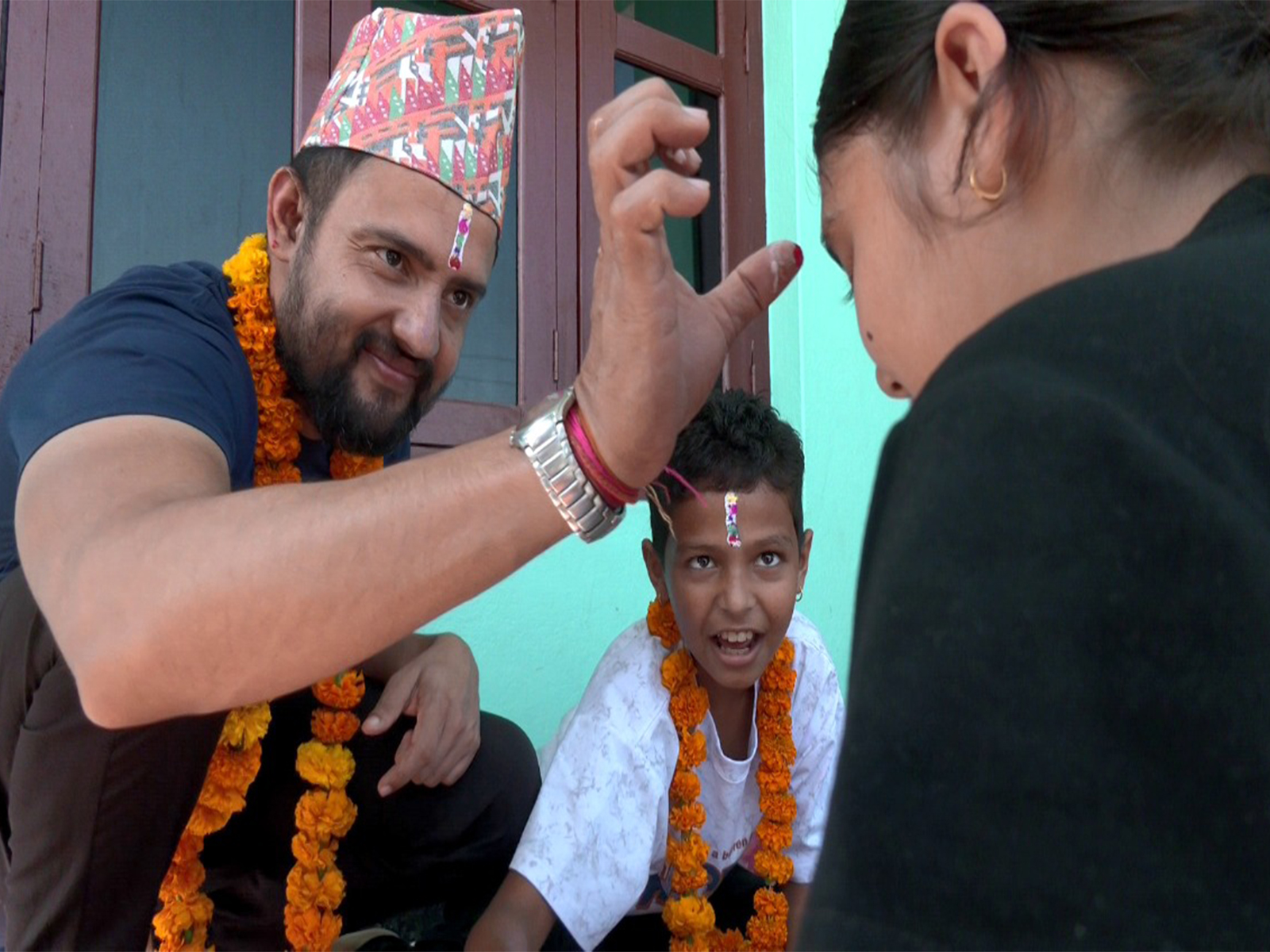 Ramesh Gautam (left) offers Tika to sister on the final day of Tihar in Bharatpur, Nepal. (Photo/ANI) Ramesh Gautam (left) offers Tika to sister on the final day of Tihar in Bharatpur, Nepal. (Photo/ANI)