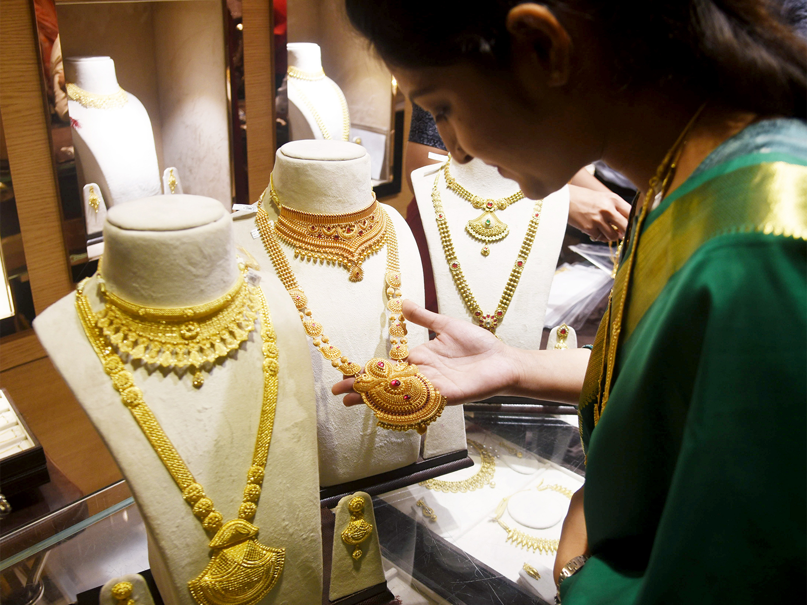 A woman shops for Gold jewellery on the occasion of Dhanteras festival (File Photo/ANI) A woman shops for Gold jewellery on the occasion of Dhanteras festival (File Photo/ANI)