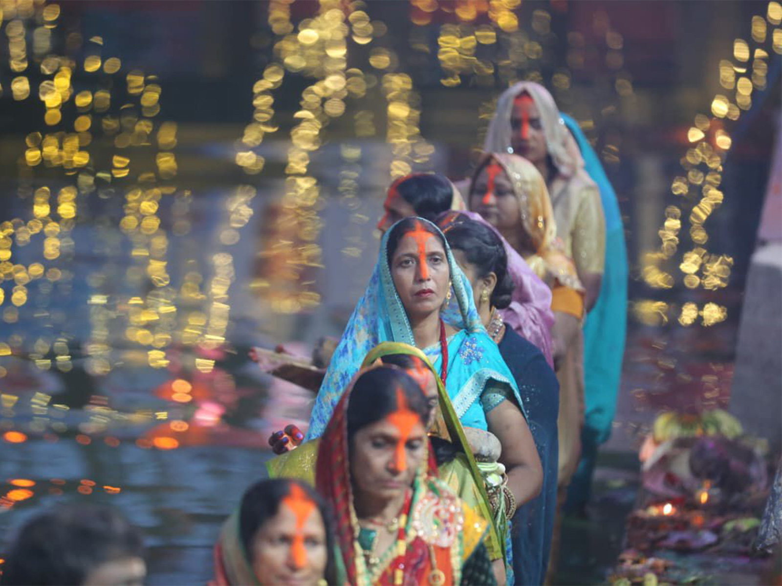 Devotees offer prayers to the rising sun during Chhath celebrations in Birgunj, Nepal. (Photo/ANI) Devotees offer prayers to the rising sun during Chhath celebrations in Birgunj, Nepal. (Photo/ANI)