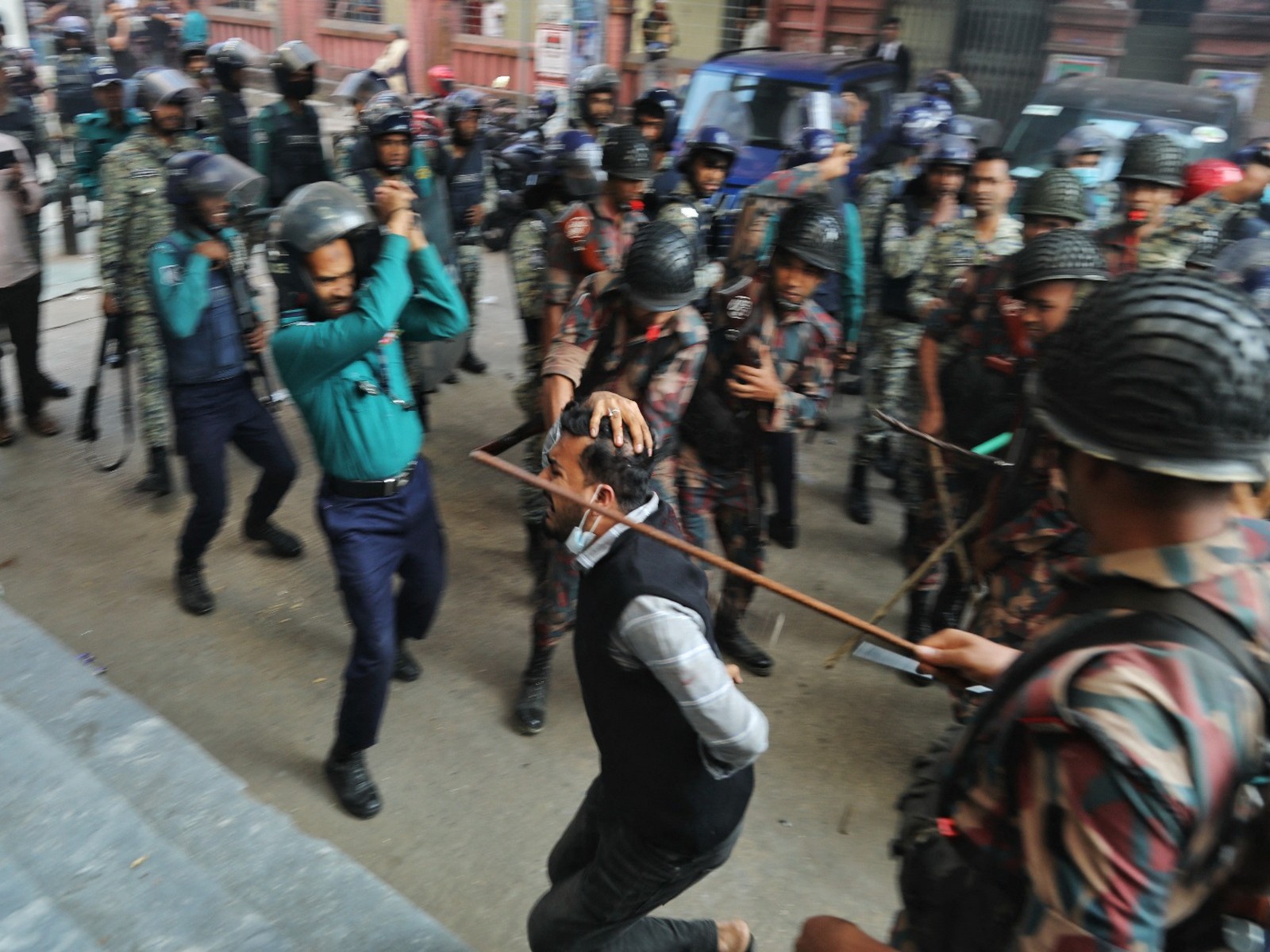 Law enforcers charge batons to disperse followers gathered to demand the release of their leader Chinmoy Krishna Das, a Hindu leader associated with the International Society for Krishna Consciousness (ISKCON), who appeared at the Chattogram Metropolitan Magistrate Court, in Chattogram (File Photo/Reuters) Law enforcers charge batons to disperse followers gathered to demand the release of their leader Chinmoy Krishna Das, a Hindu leader associated with the International Society for Krishna Consciousness (ISKCON), who appeared at the Chattogram Metropolitan Magistrate Court, in Chattogram (File Photo/Reuters)